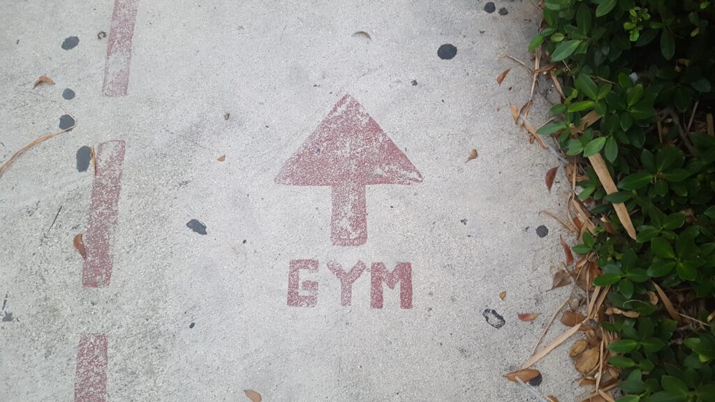 gym road signage leading to a workplace