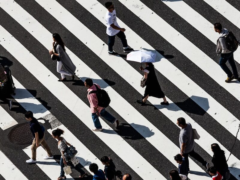 peoples walking on pedestrian lane